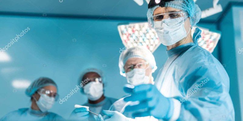 depositphotos_183827196-stock-photo-four-multiethnic-doctors-operating-room